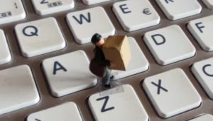 little delivery man on keyboard
