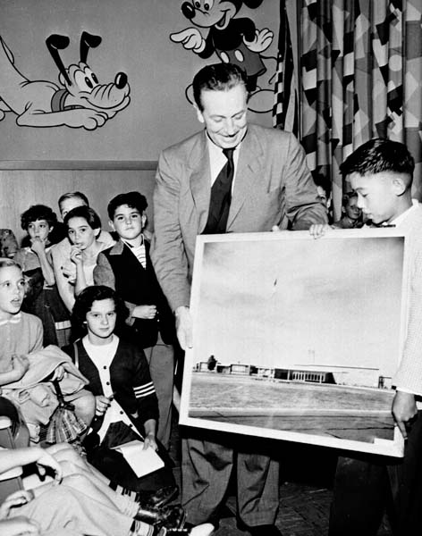 Walt Disney in Levittown presenting a picture of the school named in his honor.