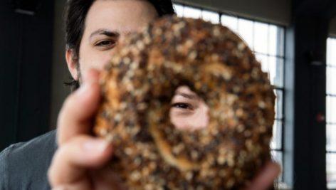 Jacob and Alexandra Cohen with a Kismet Bagel