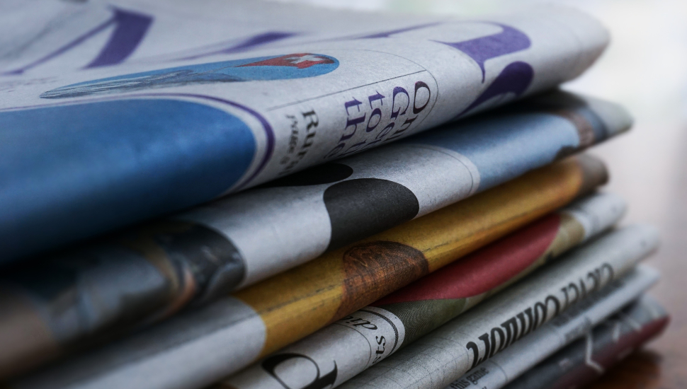 Stack of neatly folded Newspapers