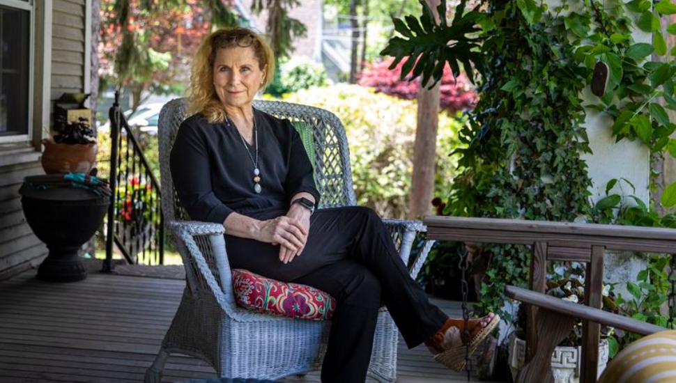 woman on porch with flowers Sears ‘Kit’ Home