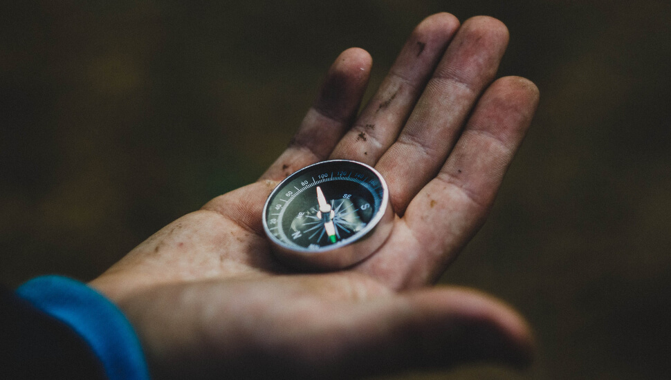 Man holding a compass