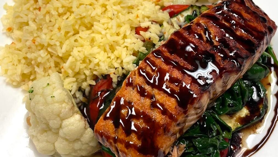Organic Scottish Salmon with glazed raspberry, pomegranate, cranberry reduction from the Canal Street Grill.