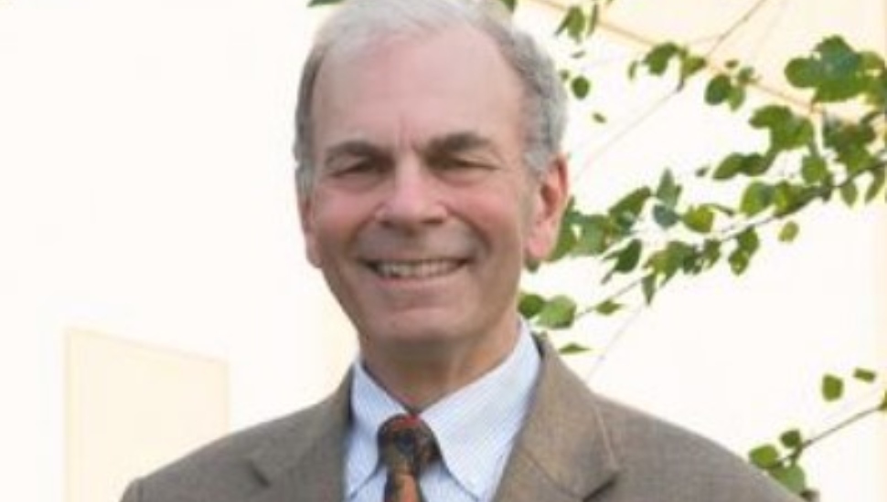 man in suit by tree