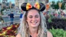 girl with mickey ears at disney