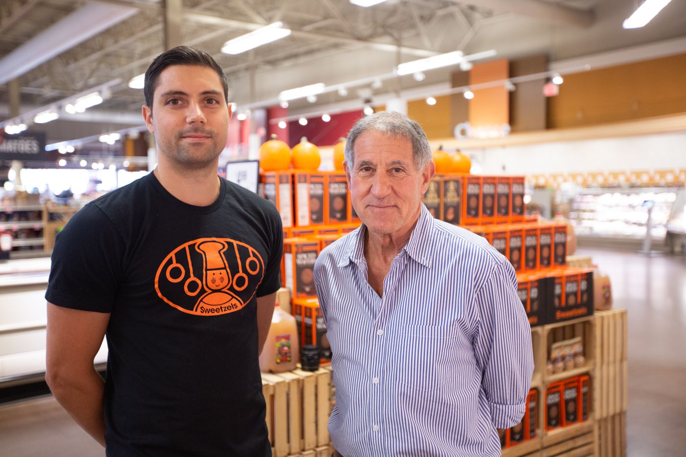 men in front of cookie display
