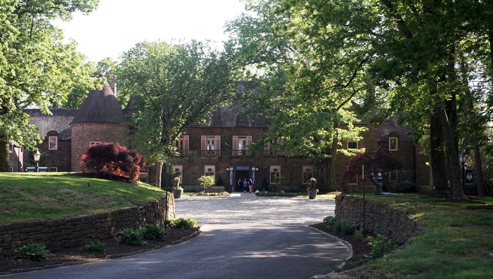 brick building at the end of a driveway