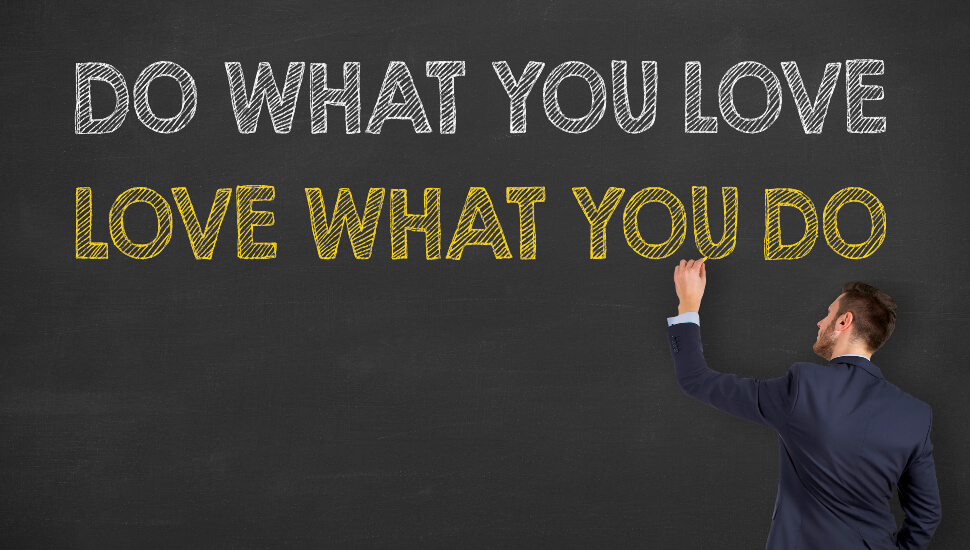 Man writing do what you love on a chalk board