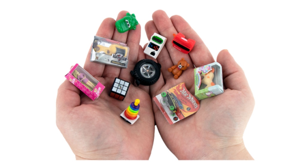 hands holding tiny toys