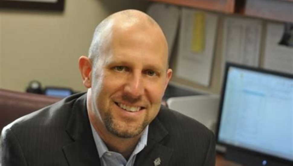 Zane Moore at his Desk.