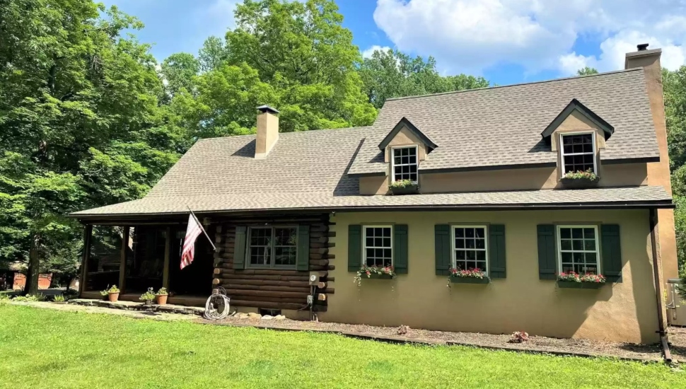 rustic home with yellow siding