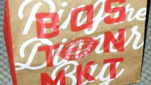brown bag with red-white text