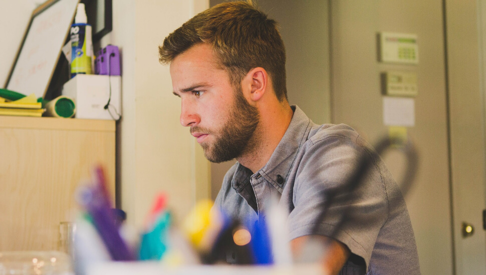 Man Working at his desk BF.