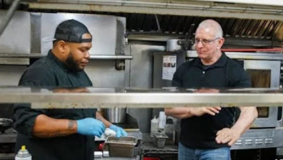 two chefs in a restaurant kitchen