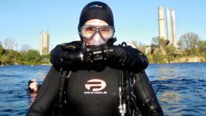 masked man in wet suit