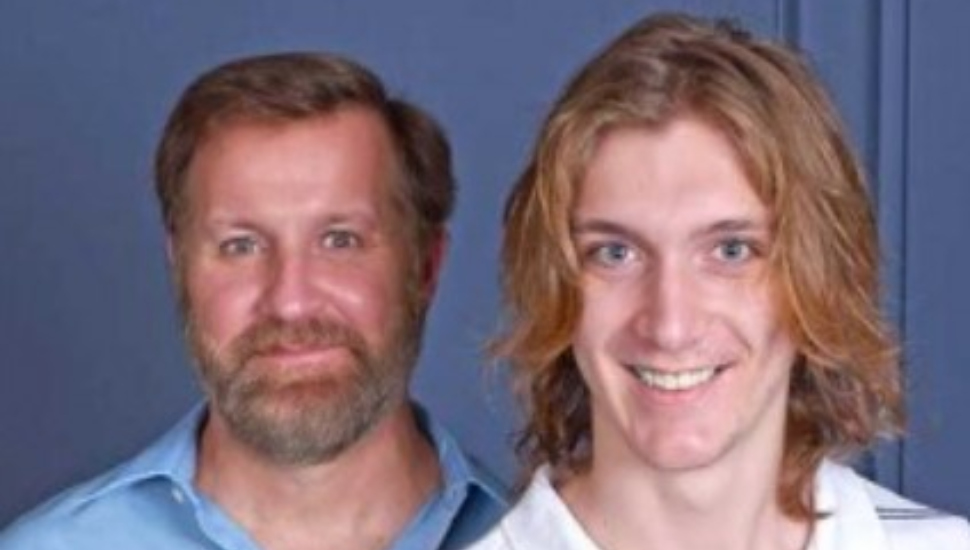 two men against blue backdrop
