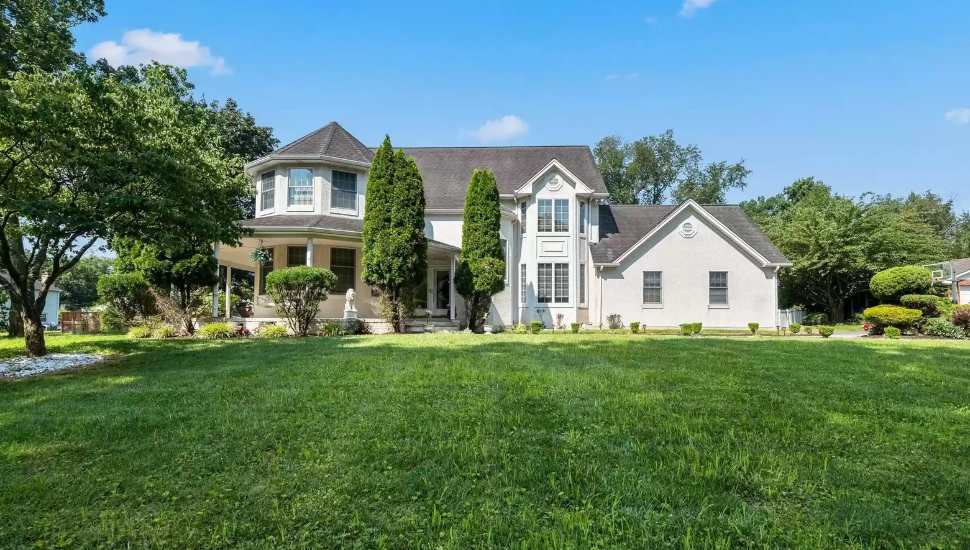wraparound house on a lawn