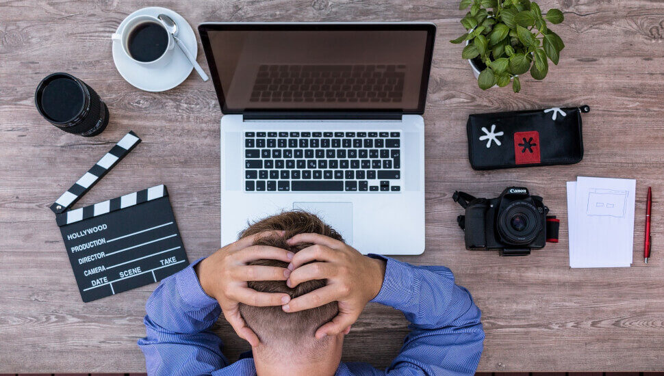 man experiencing burnout at his desk