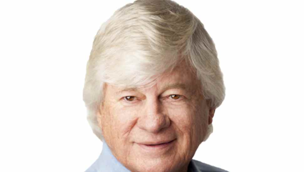 gray-haired man in blue shirt