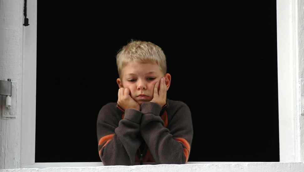 kid with chin in palms