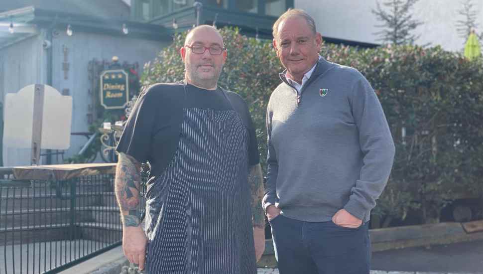 man with apron; man in sweater