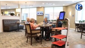 Matradee robots serve senior citizens a meal.