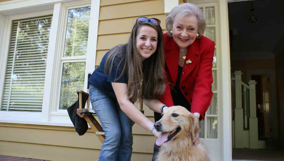 two women and a dog