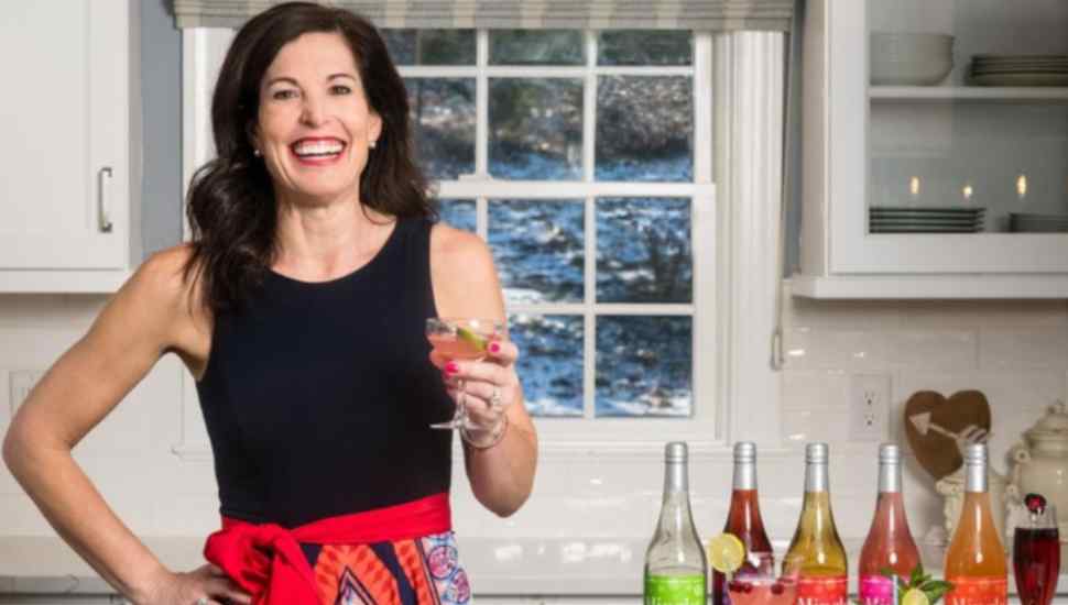 woman holding a drink