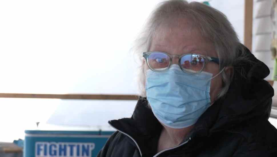 woman wearing glasses and mask