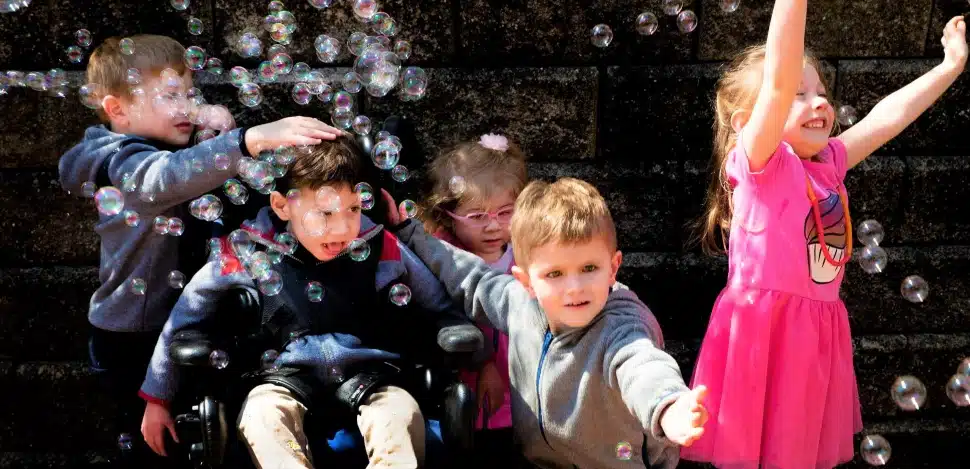Children blowing bubbles