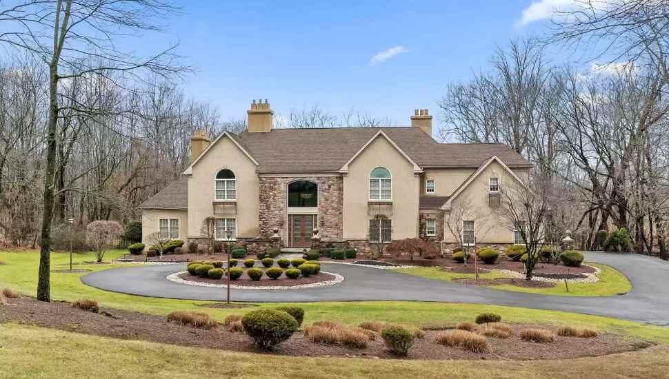 big house with circled driveway