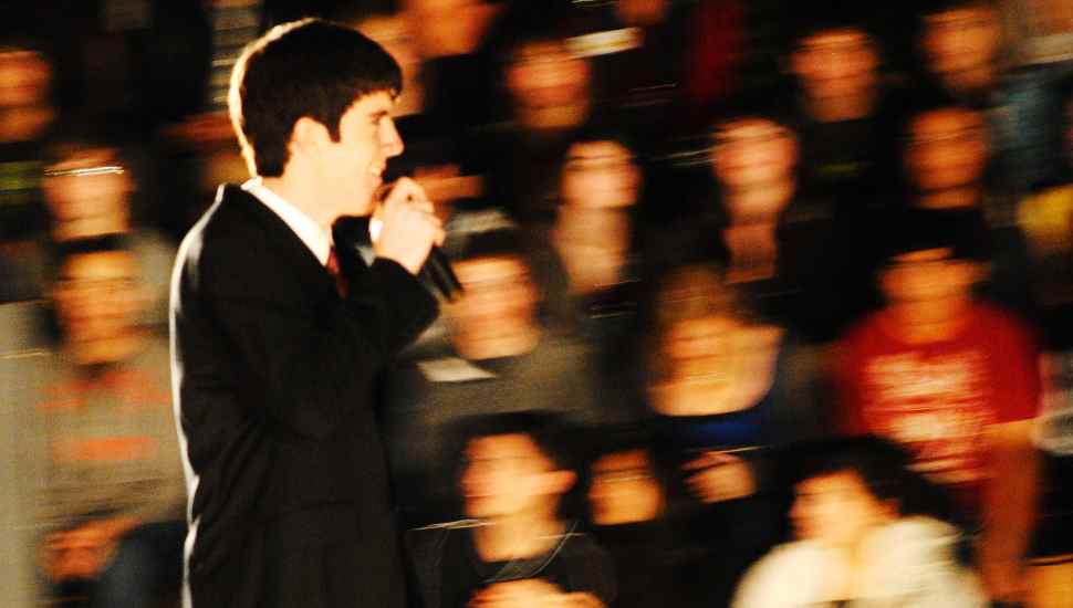 man with audience