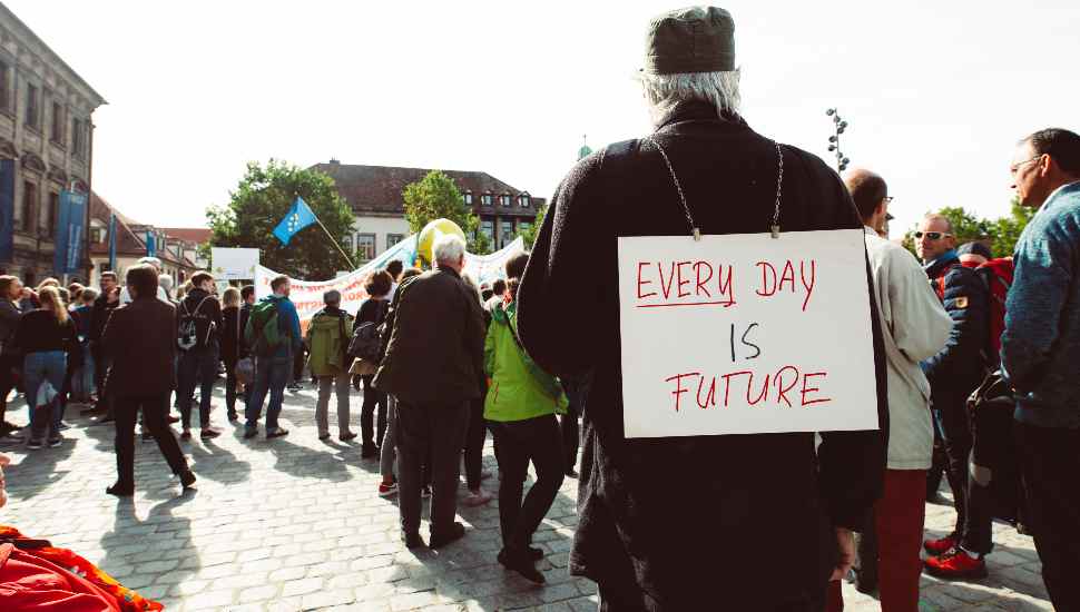man with sign on his back