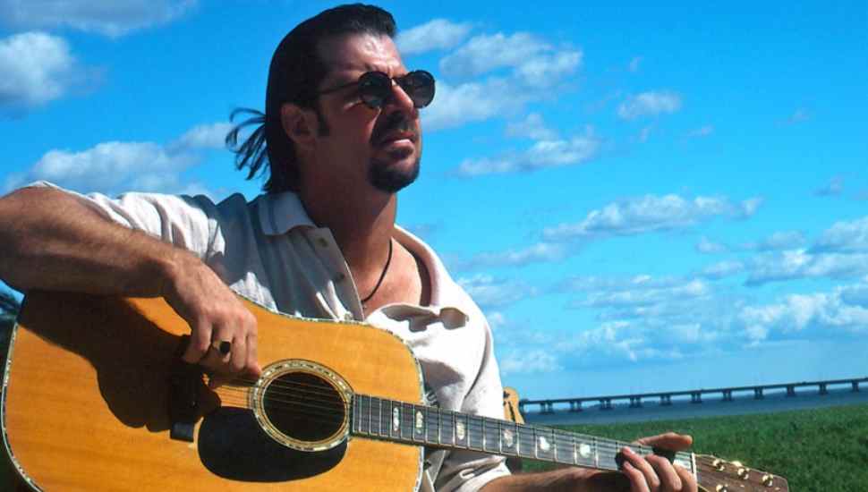 man with sunglasses and guitar