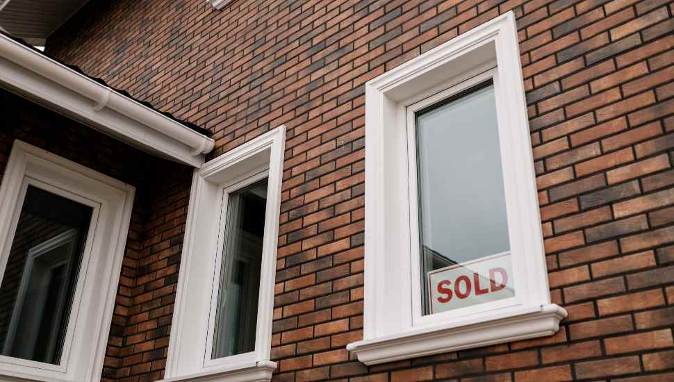 sold sign in window