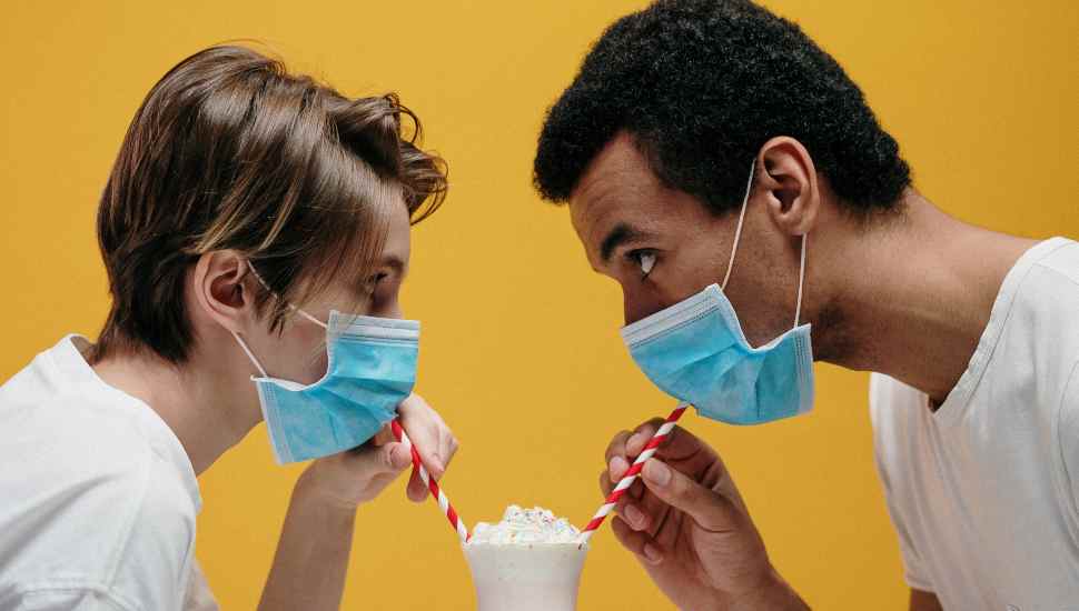two people drinking a float