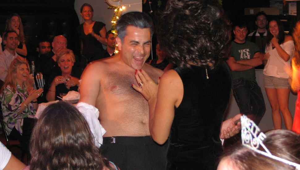 shirtless man smiling