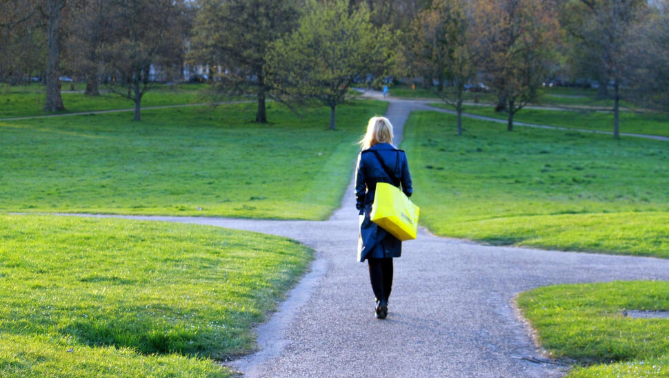 Woman walking through a park