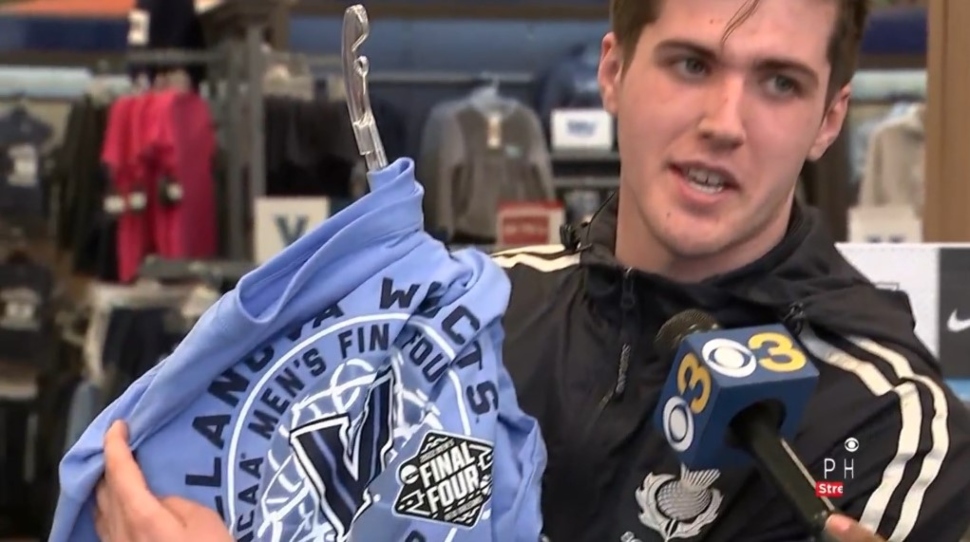 Villanova University student looking at basketball merchandise.