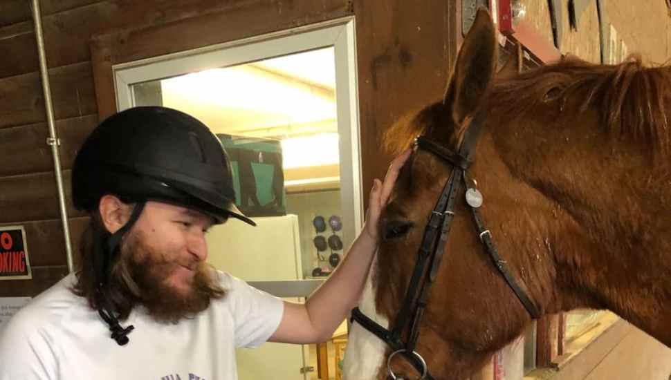 bearded man with horse