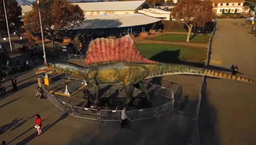 dinosaur in parking lot