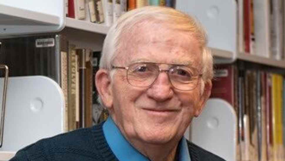 white-haired man with glasses
