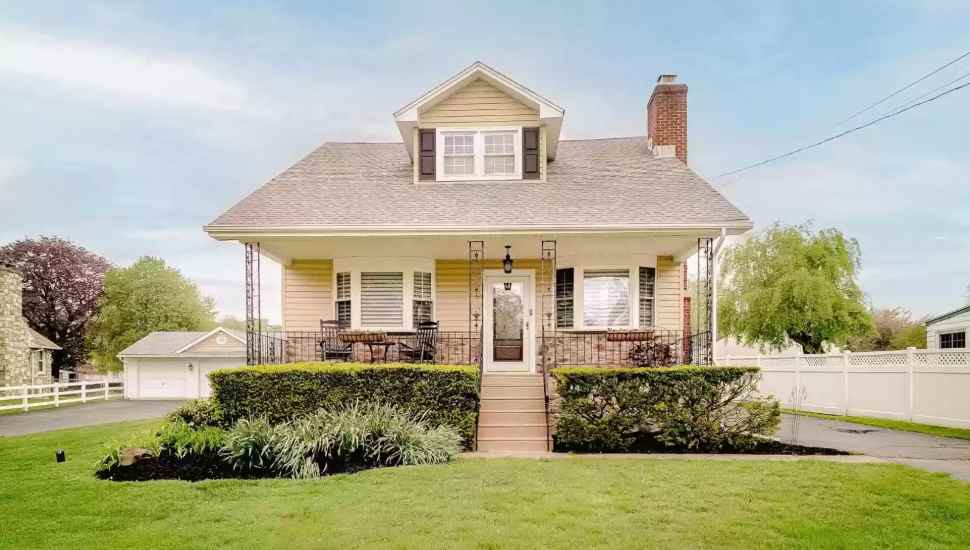 brown home with porch