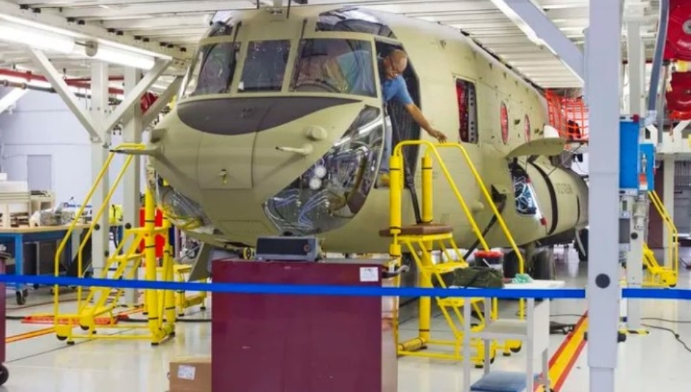 Tony Britt of Oxford exits the cockpit of a Chinook at Boeing in Ridley Park.