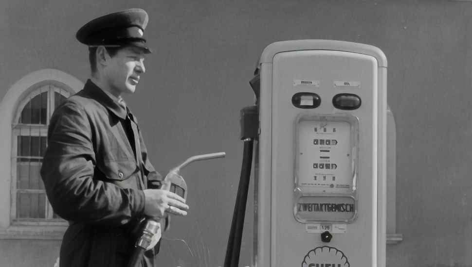 man by gas pump