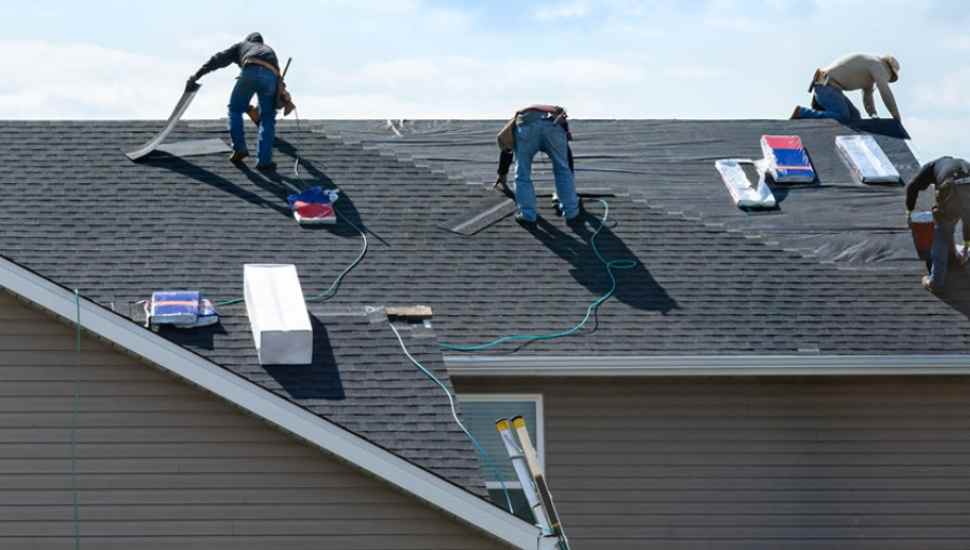 men on a roof