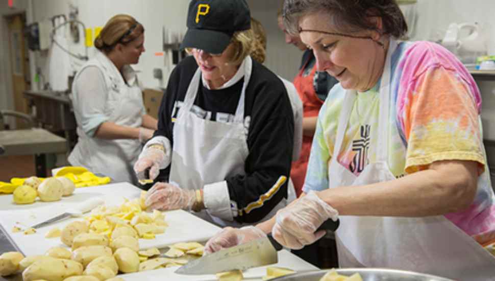 woman peeling potatoes