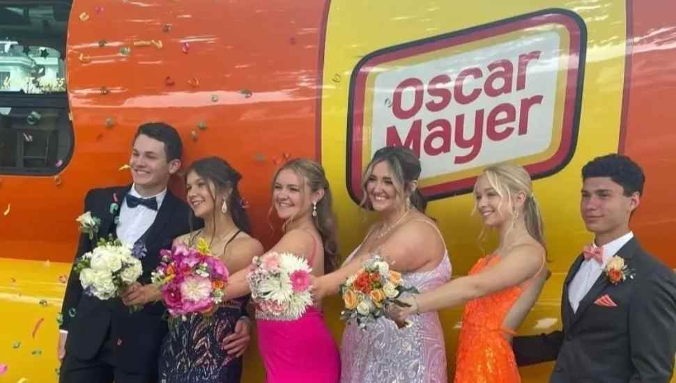dressed up kids by branded vehicle