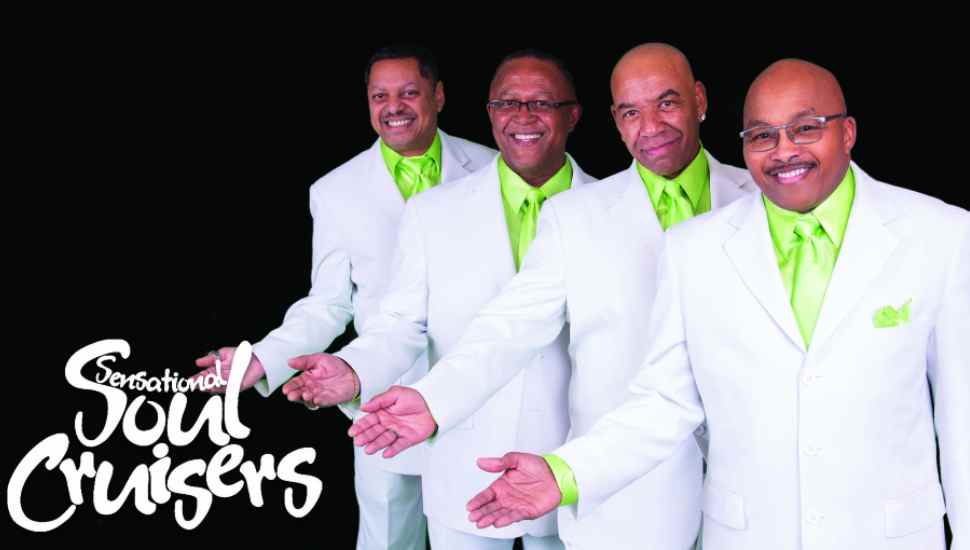 four men in white coats