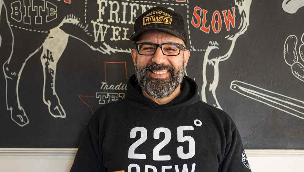 man in black hat and sweatshirt